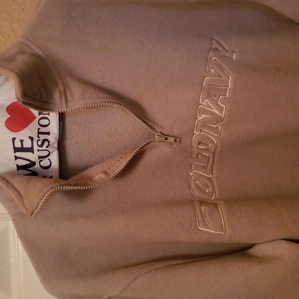 Cream colored pullover fleece jacket